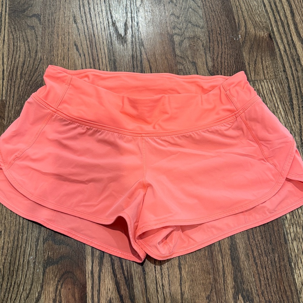 Coral lululemon shorts.  No size dot, but they are 4 reg.  In great condition